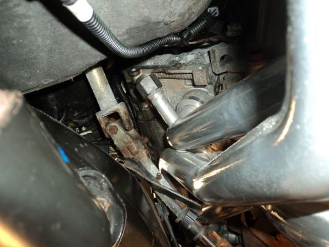 2004 Mercury Grand Marquis - Underside view of a vehicle's steering column and exhaust system components.