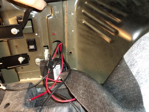 2004 Mercury Grand Marquis - Wiring and fuse box installation in a car's trunk area.