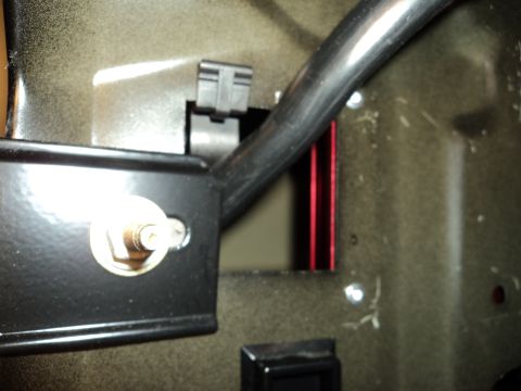 2004 Mercury Grand Marquis - Detail of a car's interior, possibly a modification, with visible hardware and structural elements.