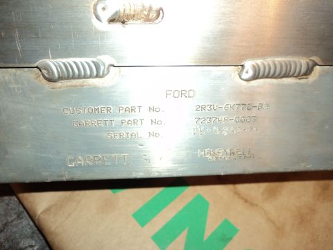 2004 Mercury Grand Marquis - This part has Ford and Garrett part numbers stamped on it, indicating it is a component rather than a complete vehicle.