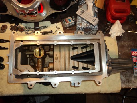 2004 Mercury Grand Marquis - Close-up of a supercharger intake manifold, part number 308728, on a workbench.