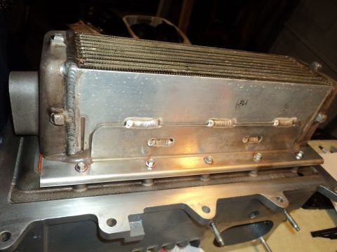 2004 Mercury Grand Marquis - A close-up view of a supercharger intercooler assembly, likely for an engine modification.