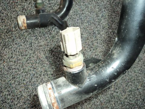 2004 Mercury Grand Marquis - A metal pipe with an attached sensor is shown against a textured background.