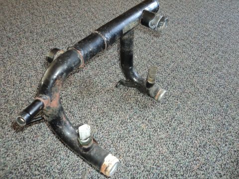 2004 Mercury Grand Marquis - This is a part of a vehicle's cooling system, likely a water pipe or thermostat housing.