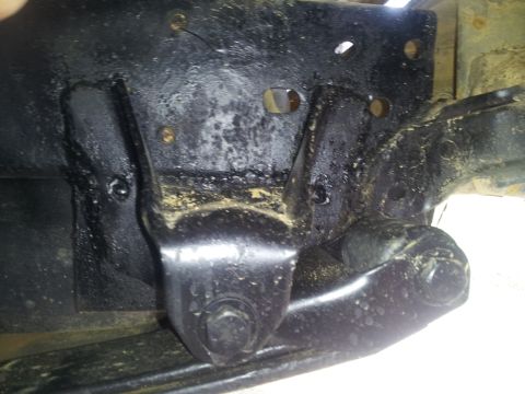 1988 Ford Bronco - Close-up of a black frame bracket, with the Supermotors.net logo in the lower right corner.