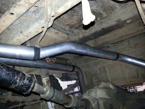 1978 Ford Bronco - Underside view shows the exhaust system and driveshaft of a vehicle.