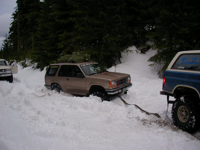 I didn't end up in the ditch this time ! But I did get a little buried in the deep snow as we were backing out to leave. So Tim gave me a tug.