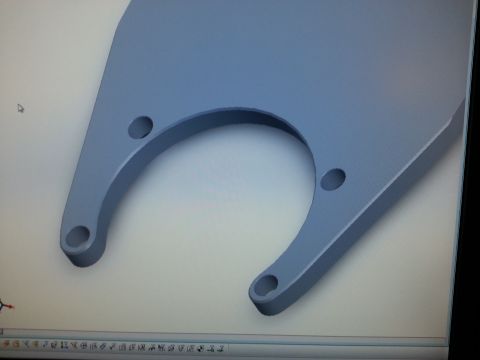 1967 Ford F-100 - Photograph of a monitor displaying a 3D CAD model of a U-shaped mounting bracket, with no dimensions shown.