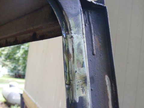 1978 Ford Bronco - Close-up of a metal frame section showing welds and grinding marks.