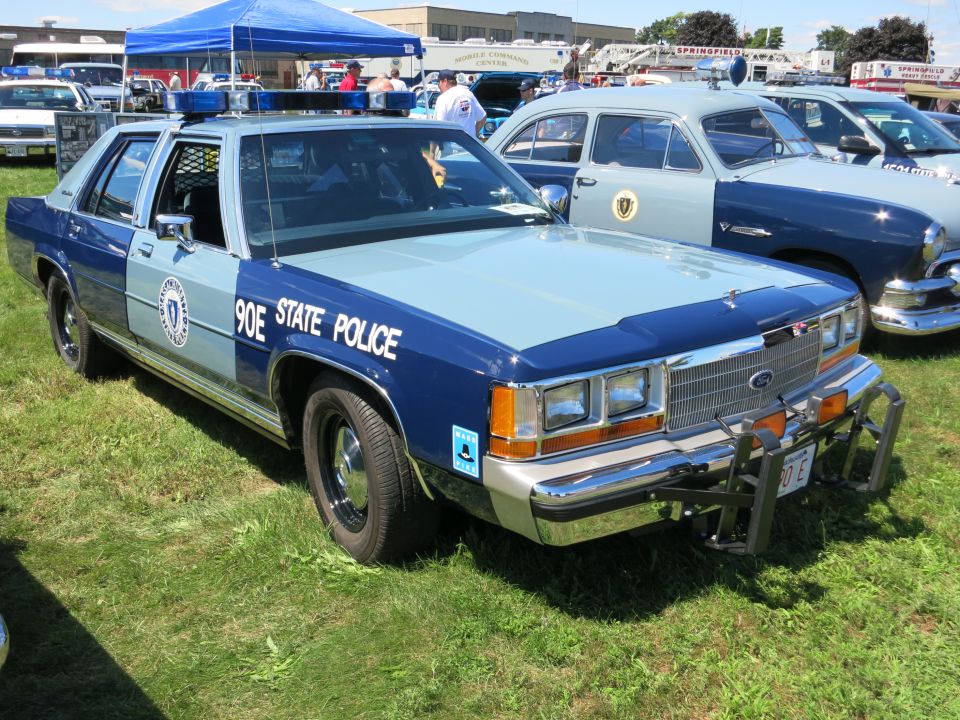 Massachusetts State Police car with "90E STATE POLICE" text on the side