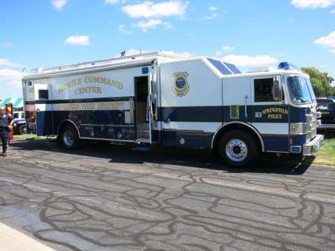 2001 Ford Crown Victoria - This is a Springfield Police mobile command center truck, with text indicating 'MOBILE COMMAND CENTER' and 'SPRINGFIELD POLICE'.