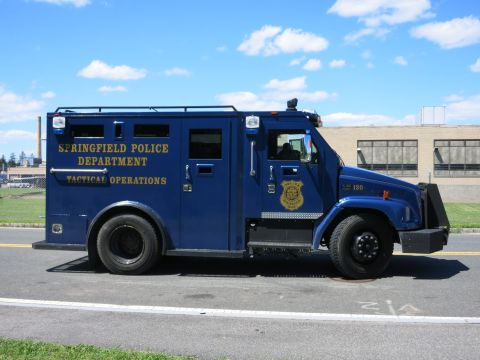 2001 Ford Crown Victoria - A blue tactical operations vehicle belonging to the Springfield Police Department is parked on a street.