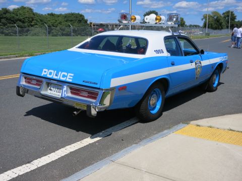 2001 Ford Crown Victoria - This police car, marked '1959', is a classic vehicle with a distinctive blue and white paint scheme.