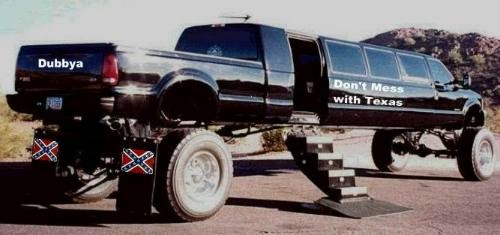 Black custom truck limousine with "Dubbya" and "Don't Mess with Texas" text, and Confederate flags on mudflaps