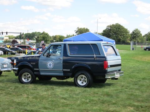 2001 Ford Crown Victoria - Ford Bronco with Massachusetts State Police markings seen at an outdoor event.