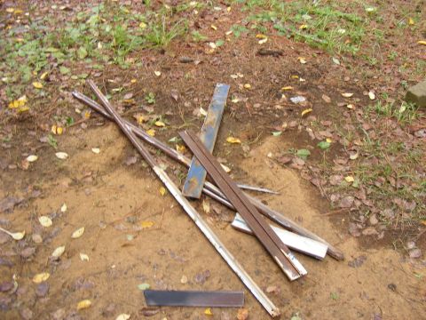 Pile of scrap metal pieces on the ground