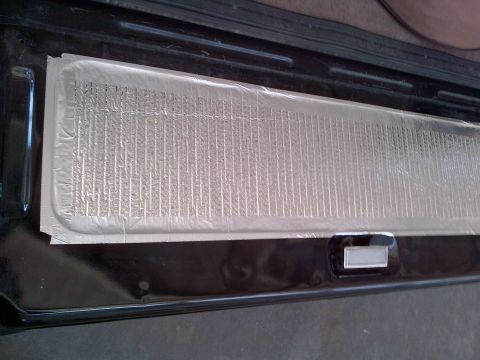 1994 Ford Bronco - Insulation has been applied to a section of the vehicle's interior panel, covering a vent.