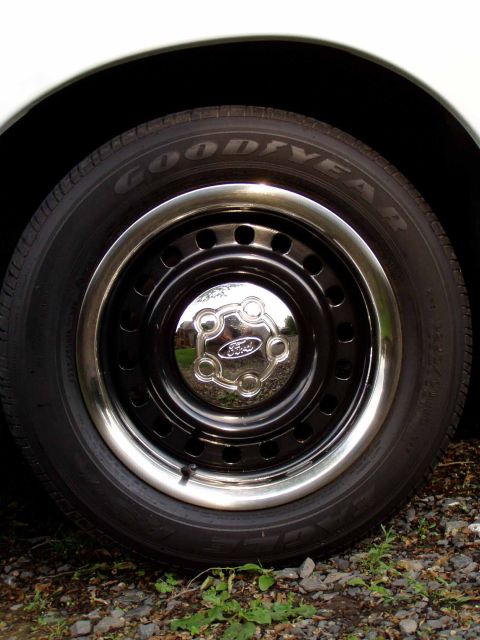 1999 Ford Crown Victoria - This is a close-up of a Ford wheel and tire, not a full vehicle.