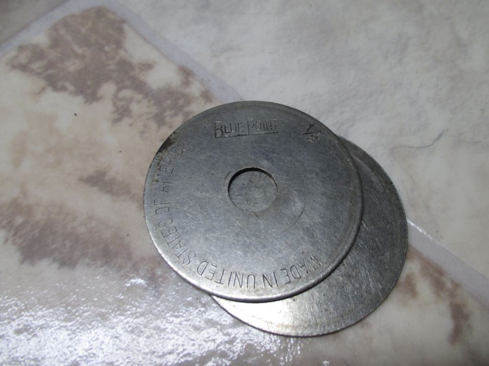 Two metal washers, one stamped 'BLUE POINT' and 'MADE IN UNITED STATES OF AMERICA'