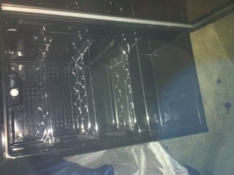 2003 Ford Crown Victoria - The interior of an oven, showing the racks and heating elements.