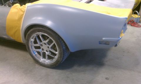 1976 Chevrolet Corvette - Rear quarter panel and wheel of a 1976 Chevrolet Corvette undergoing bodywork.