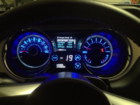 2013 Ford Mustang - The digital display within the 2013 Ford Mustang's dashboard shows engine data and mileage.