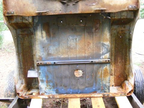 rusted vehicle frame section with blue paint visible