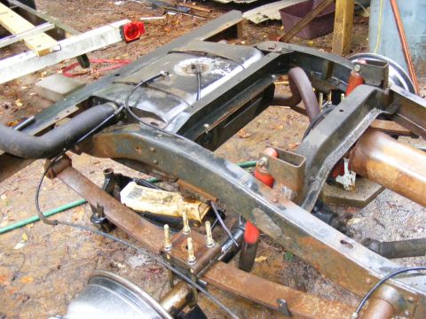 1978 Ford Bronco frame with fuel tank, rusty, viewed from above and rear