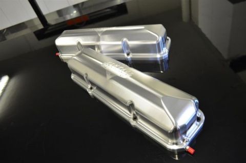 1963 Ford Fairlane - Polished aluminum valve covers, one with 'VINTAGE' branding, sit on a dark surface.
