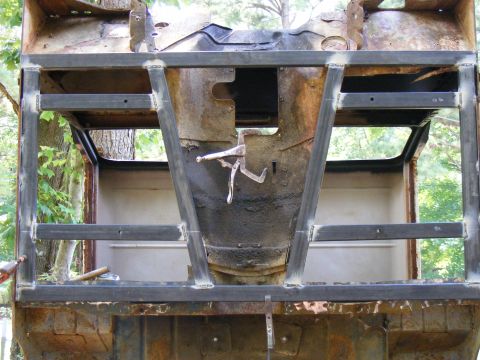 welding new frame to rusty vehicle body, looks like a Bronco or similar SUV