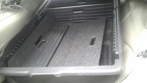 2000 Mercury Grand Marquis - Trunk interior with organizer and carpeted floor. Rear seats are visible.