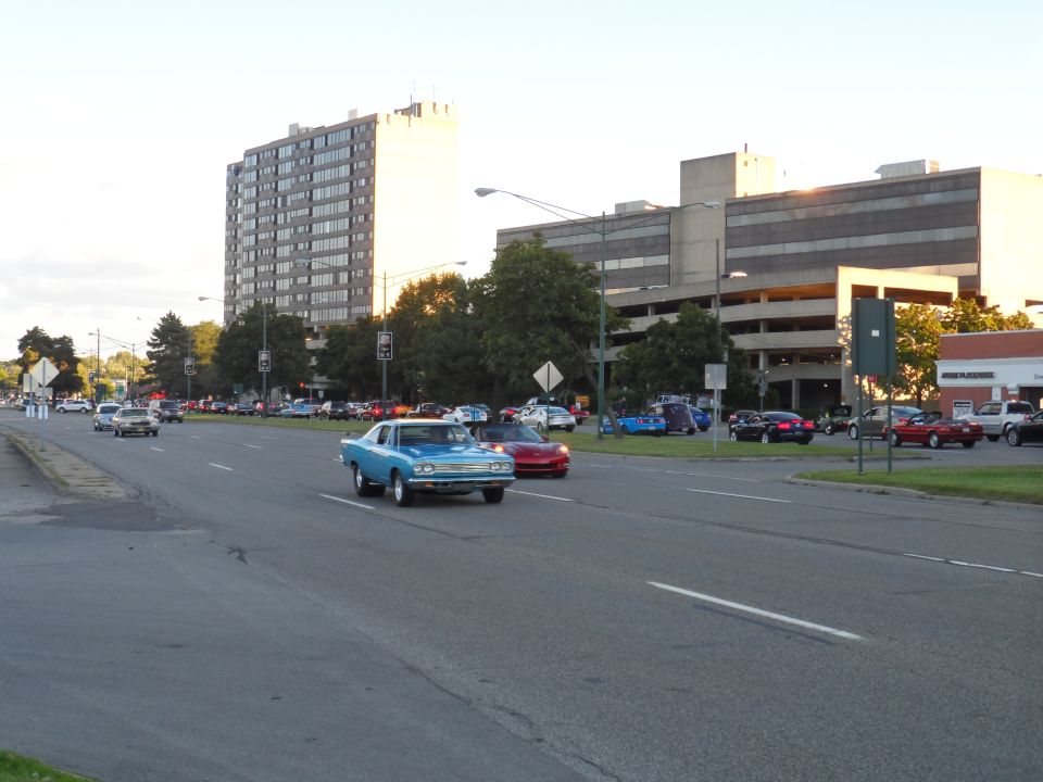 Blue 1969 Plymouth Road Runner coupe driving on a road