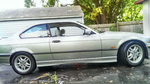1997 BMW 3 Series - Side profile of a silver BMW 3 Series coupe with a clean exterior.
