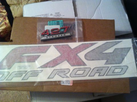1982 Ford Bronco - Decals for a vehicle, including a "427 Stroker" emblem and "4x4 Off Road" graphics.
