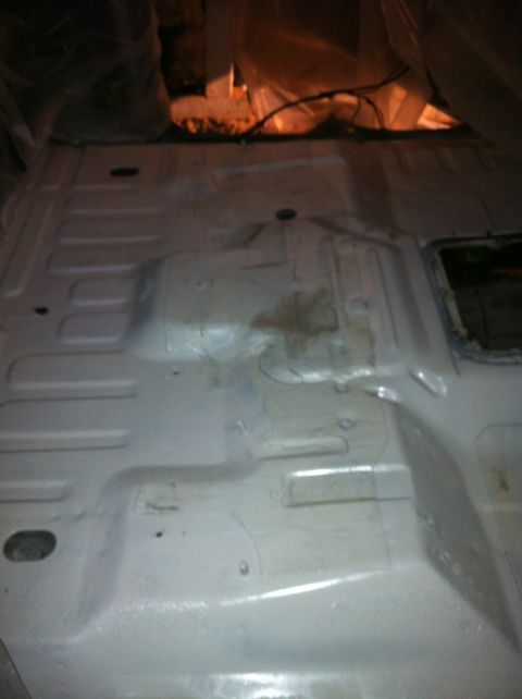 1992 Ford Bronco - Vehicle floor pan interior, showing structural details and some discoloration.