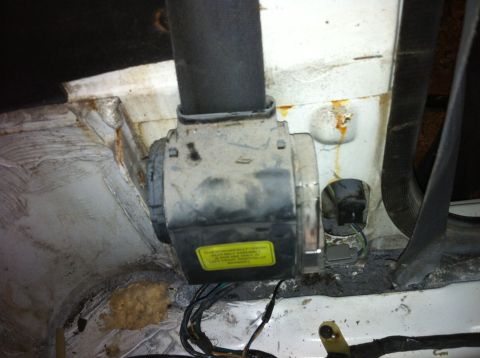 1992 Ford Bronco - A yellow sticker with text is visible on a dirty automotive part, with wiring attached.