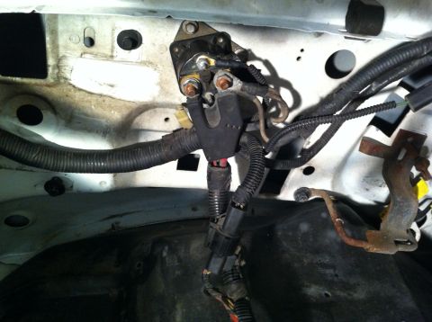 1992 Ford Bronco - Close-up view of the engine bay wiring and starter solenoid, showing a section of the wiring harness.