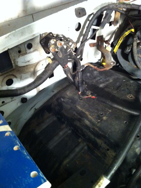 1992 Ford Bronco - Close-up view of the engine bay wiring harness and starter solenoid, likely during a swap or repair.