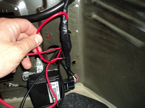2004 Mercury Grand Marquis - Close-up of automotive wiring and electrical components, likely part of an aftermarket modification.