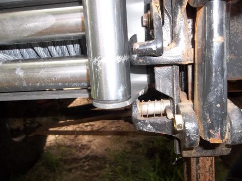 1995 Ford Bronco - Detail of a winch mechanism, showing the drum and a spring-loaded engagement pin.