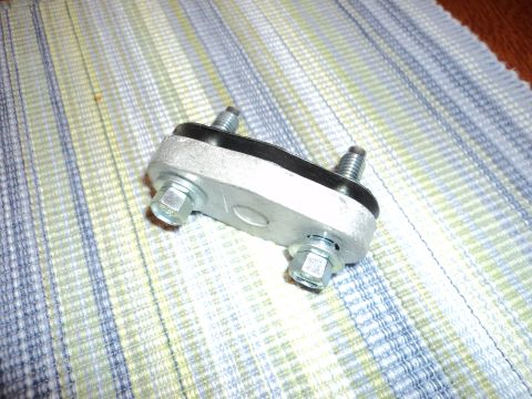 2004 Mercury Grand Marquis - A close-up view of an automotive part, likely a mount or bracket, metal and rubber components.