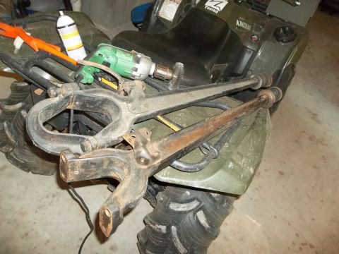 1995 Ford Bronco - An ATV is loaded with tools and automotive parts, not a 1995 Ford Bronco.