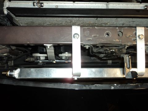 2004 Mercury Grand Marquis - Underside view of a vehicle's front end, showing the radiator and cooling fan assembly.