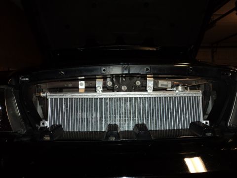 2004 Mercury Grand Marquis - Aftermarket radiator installed in the front of a vehicle, likely part of an engine modification.