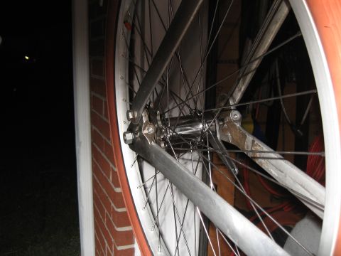 1994 Ford Bronco - Close-up view of a bicycle's rear wheel and frame, showing the spokes and hub assembly.