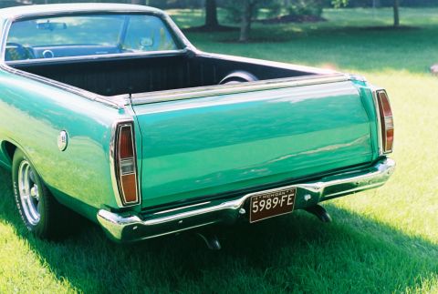 1971 Ford Ranchero - This 1971 Ford Ranchero features a distinctive rear end with chrome accents and a prominent tailgate.