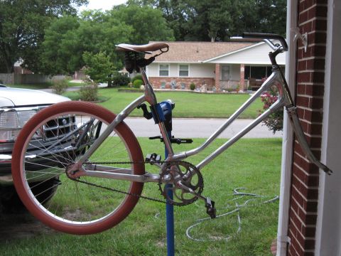 1994 Ford Bronco - Custom bicycle frame being worked on, with a truck in the background.
