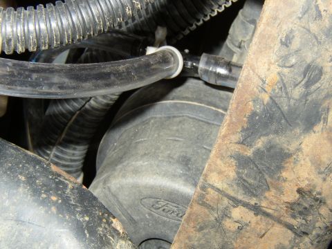 1989 Ford Bronco - where the transfer case t's into the line that runs fron to rear.