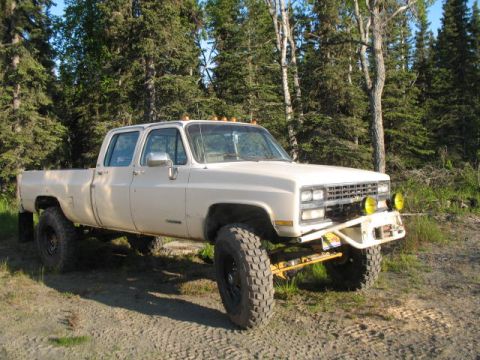 1989 Chevrolet C/K Pickup - This 1987 Chevrolet C/K Pickup features a lifted suspension and large off-road tires.