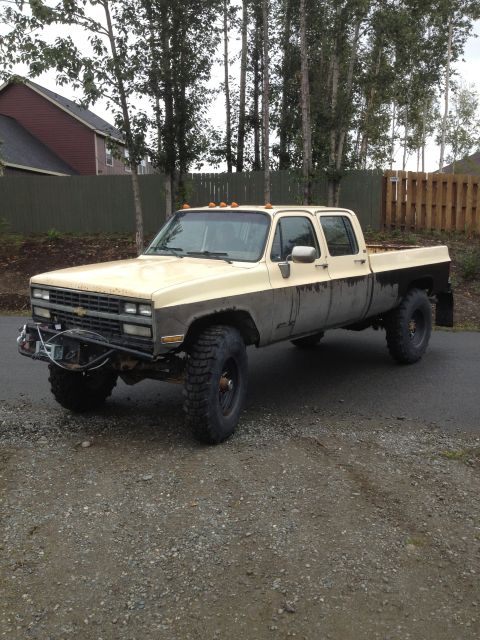 1989 Chevrolet C/K Pickup - This lifted 1989 Chevrolet C/K Pickup features a two-tone paint scheme and off-road tires.
